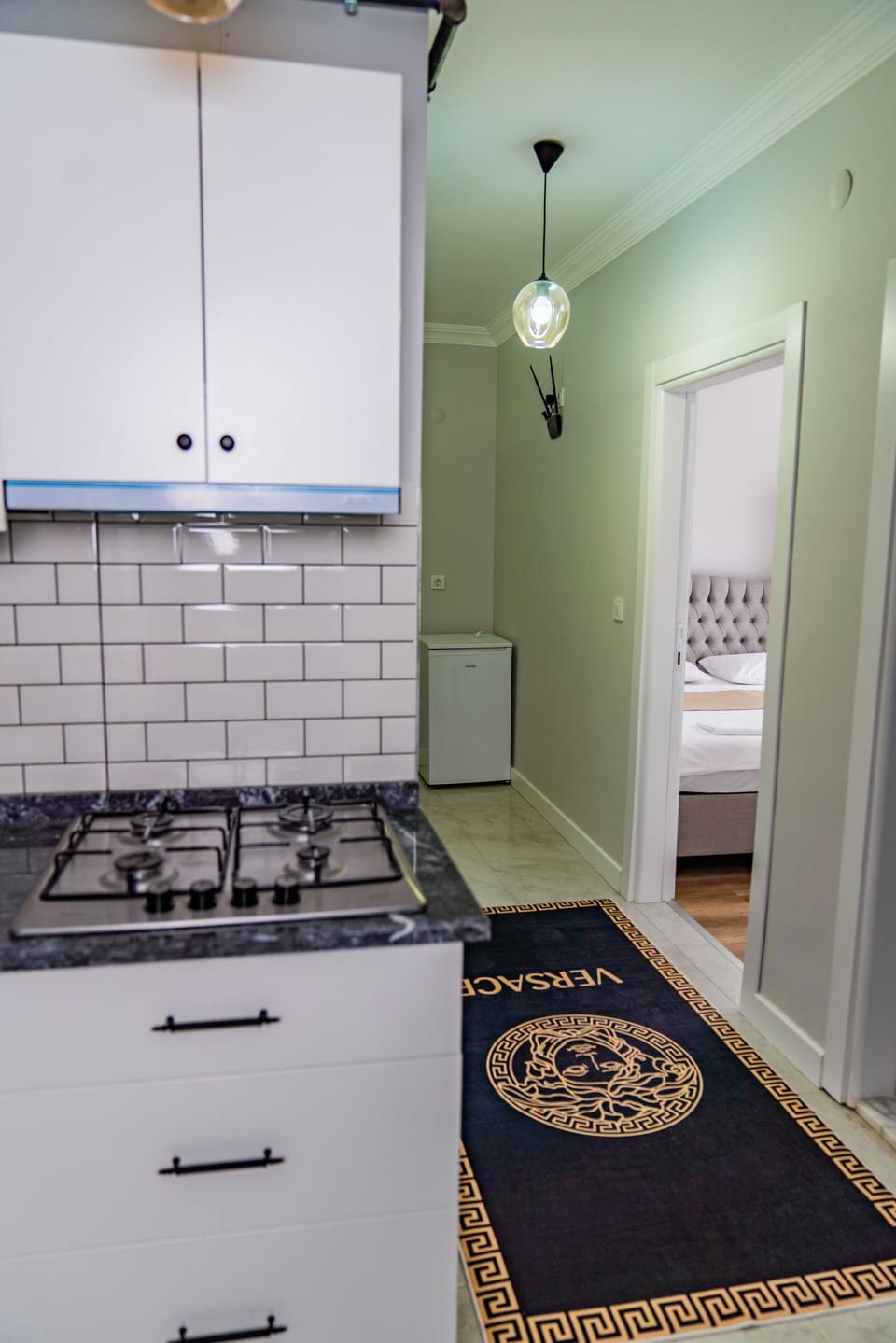 Mini-fridge, stovetop, griddle, cookware/dishes/utensils