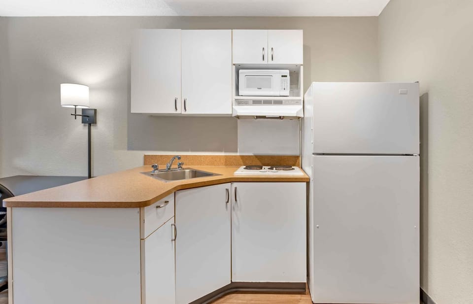 Studio, 1 Queen Bed, Non Smoking | Private kitchen | Full-size fridge, microwave, stovetop, coffee/tea maker