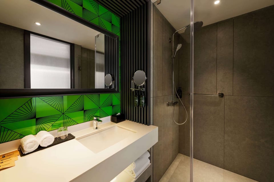 Rainfall showerhead, eco-friendly toiletries, hair dryer, slippers