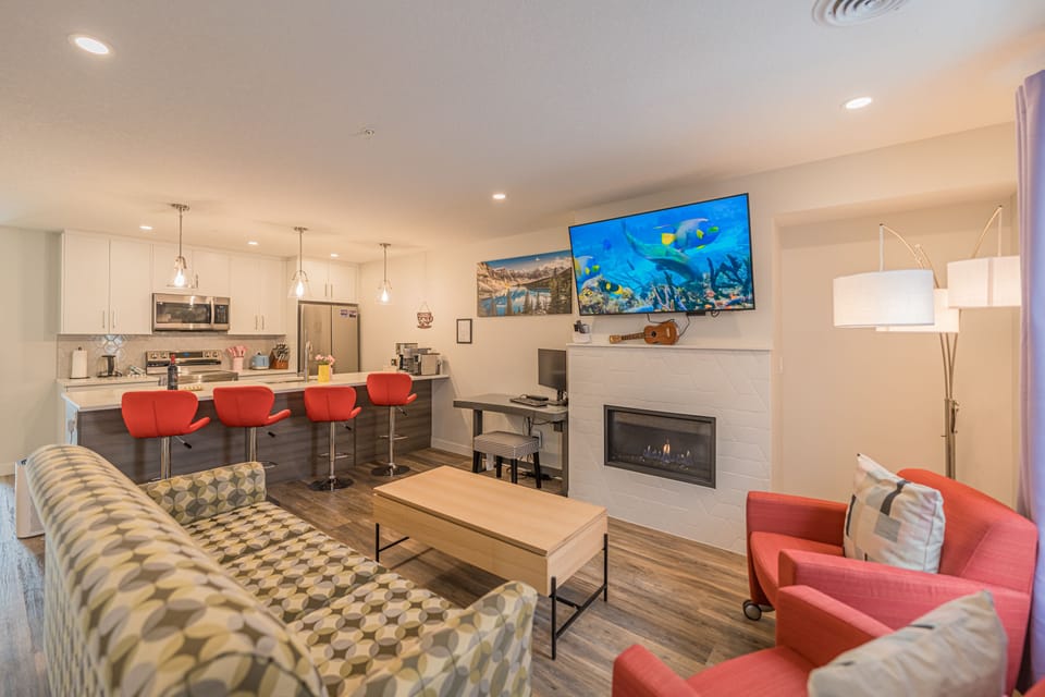 Family Townhome | Living area | 60-inch Smart TV with cable channels, TV, fireplace