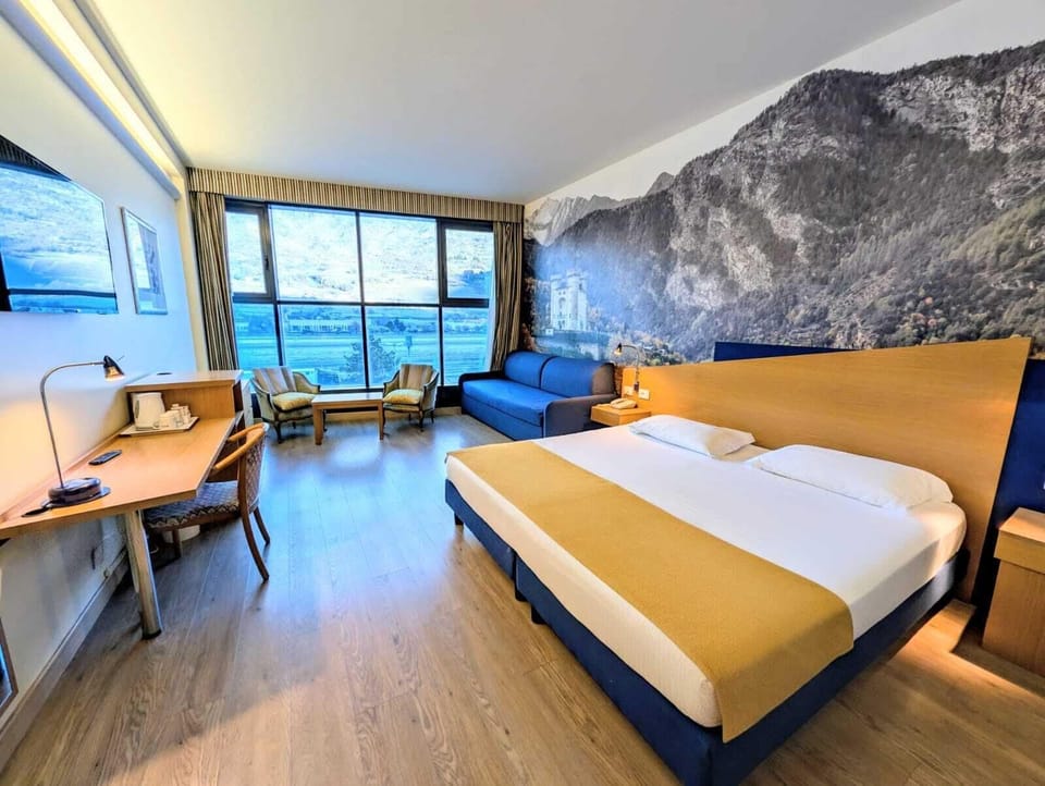 Deluxe Double or Twin Room | Minibar, desk, blackout drapes, iron/ironing board
