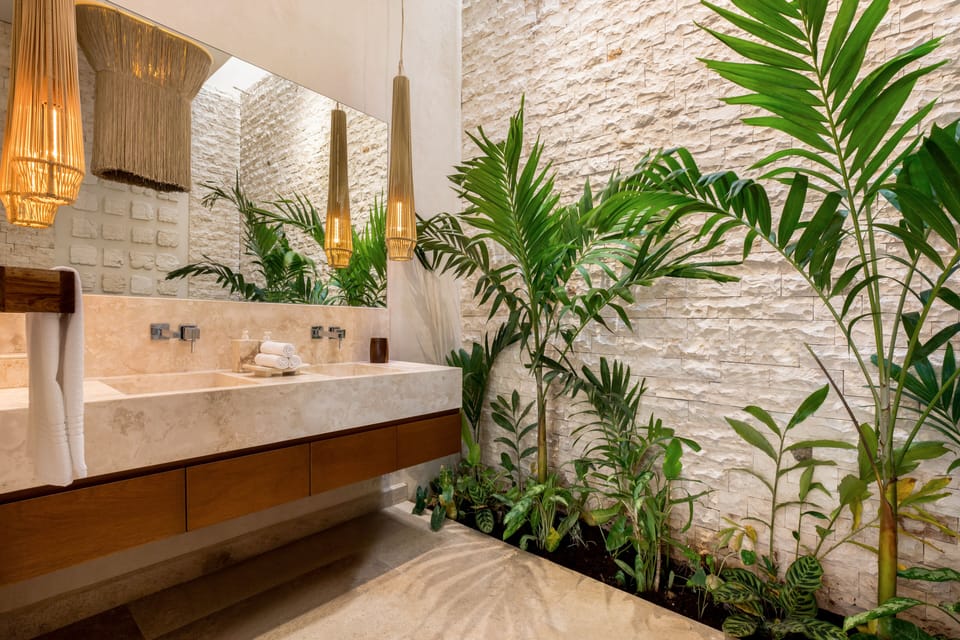 Deluxe Room | Bathroom | Designer toiletries, hair dryer, bathrobes, towels