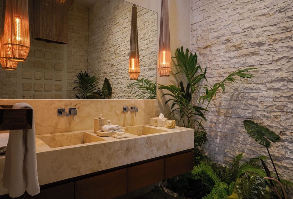 Deluxe Room | Bathroom | Designer toiletries, hair dryer, bathrobes, towels