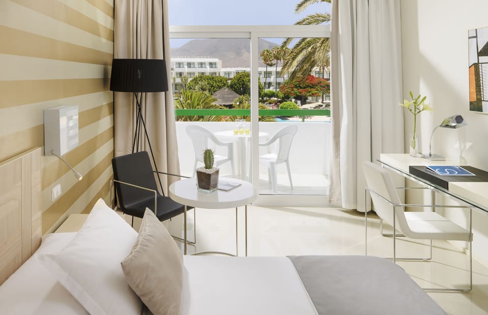 Minibar, desk, bed sheets