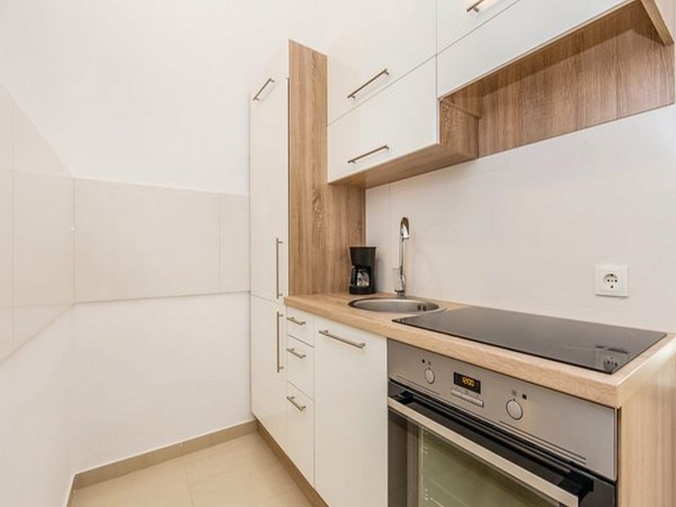 Apartment (Superior One bedroom Apartment with T) | Private kitchen | Fridge, dining tables