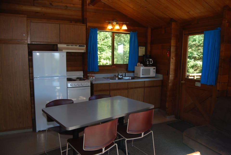 Fridge, microwave, coffee/tea maker, cookware/dishes/utensils
