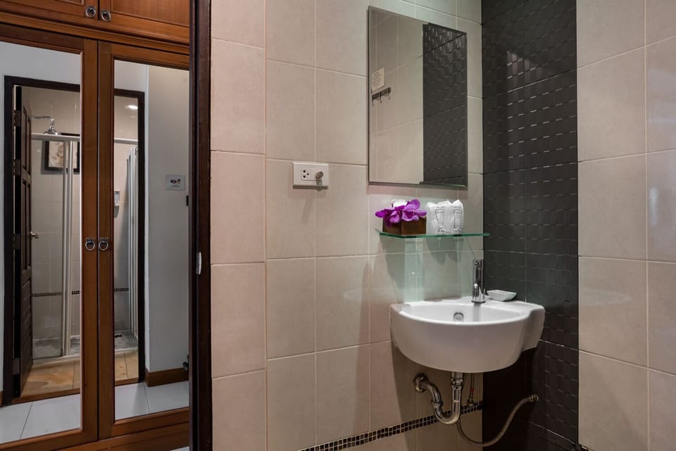 Shower, free toiletries, hair dryer, slippers