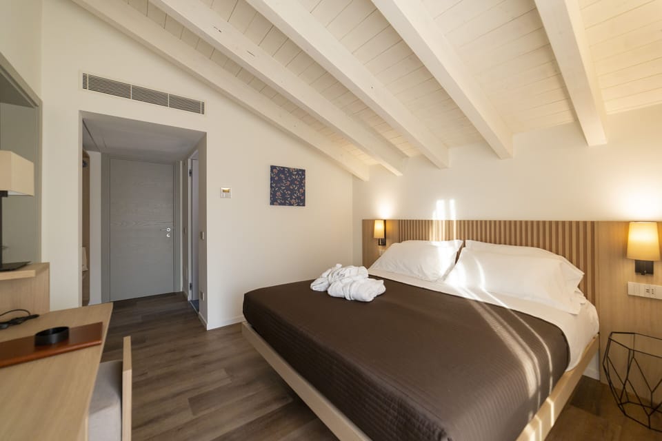Comfort Room | Premium bedding, desk, laptop workspace, soundproofing