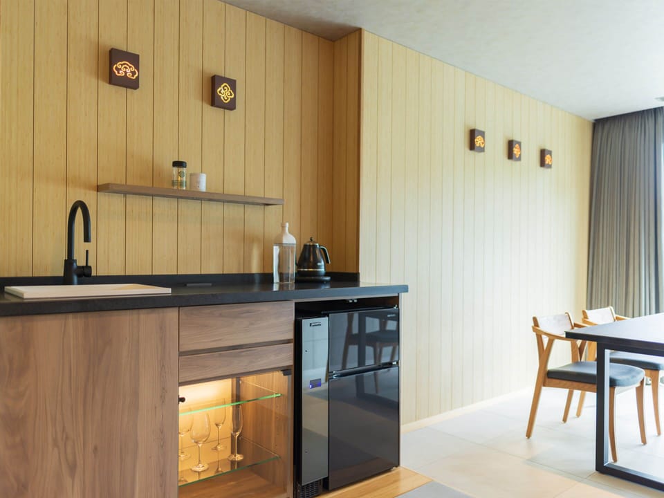 Deluxe Quadruple Room, Private Bathroom | In-room safe, desk, WiFi (free), bed sheets
