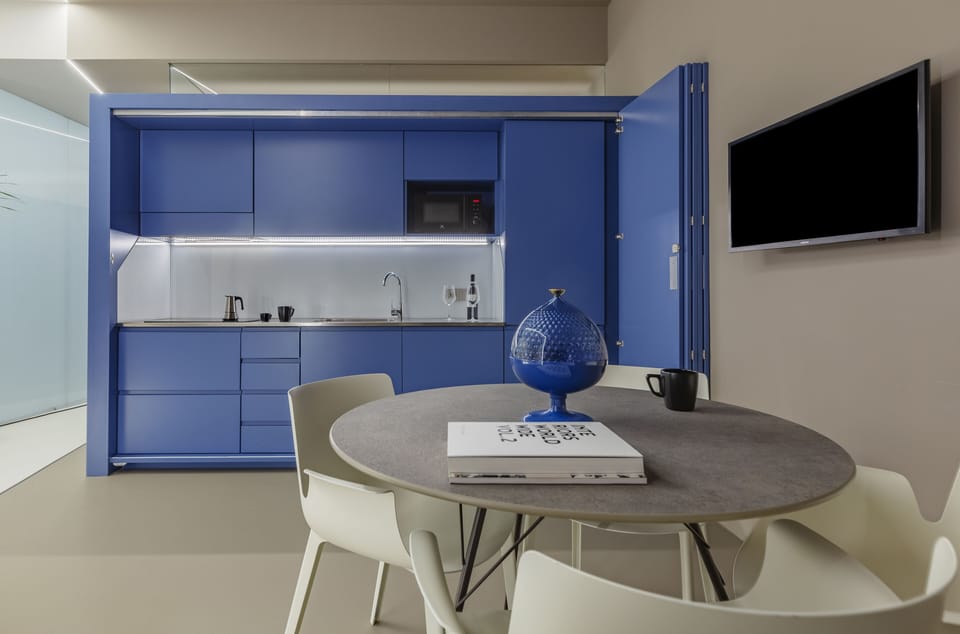 Royal Suite | Private kitchen | Mini-fridge, espresso maker, highchair, cleaning supplies