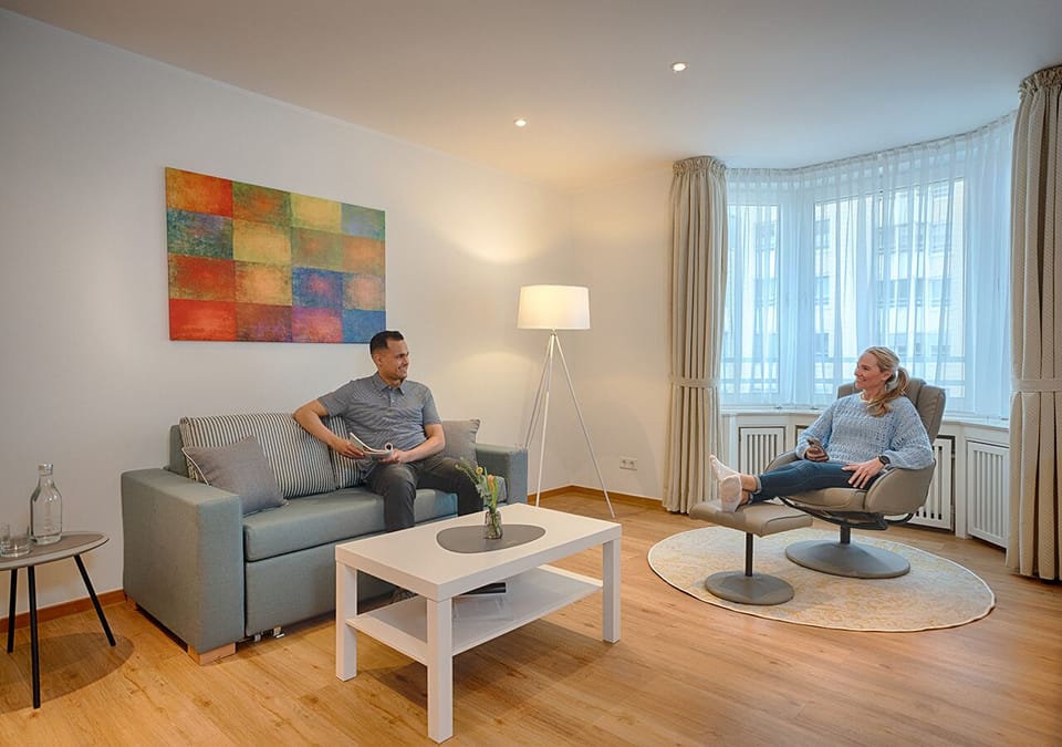 Standard Suite | Living area | 43-inch LED TV with cable channels, offices