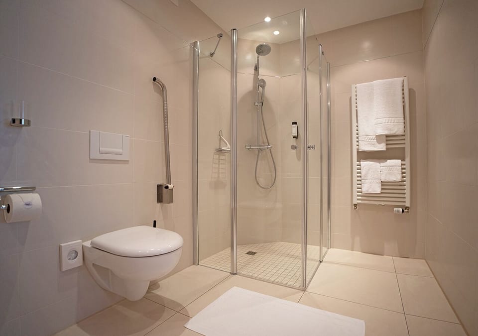 Shower, rainfall showerhead, hair dryer, heated floors