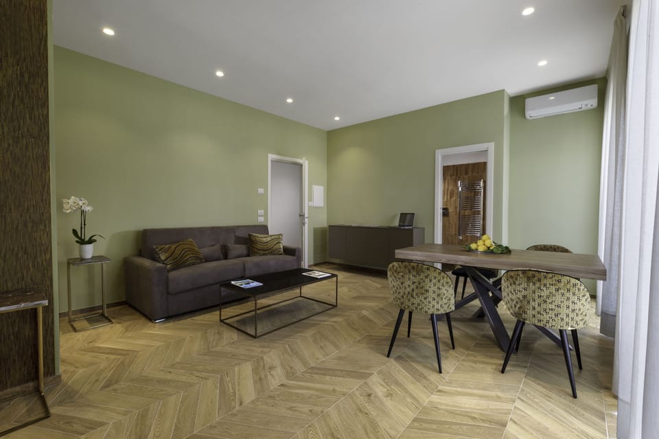 Family Quadruple Room | Down comforters, minibar, in-room safe, individually decorated