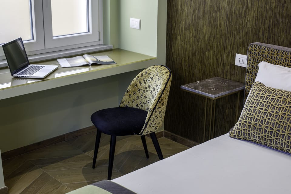 Family Quadruple Room | Down comforters, minibar, in-room safe, individually decorated