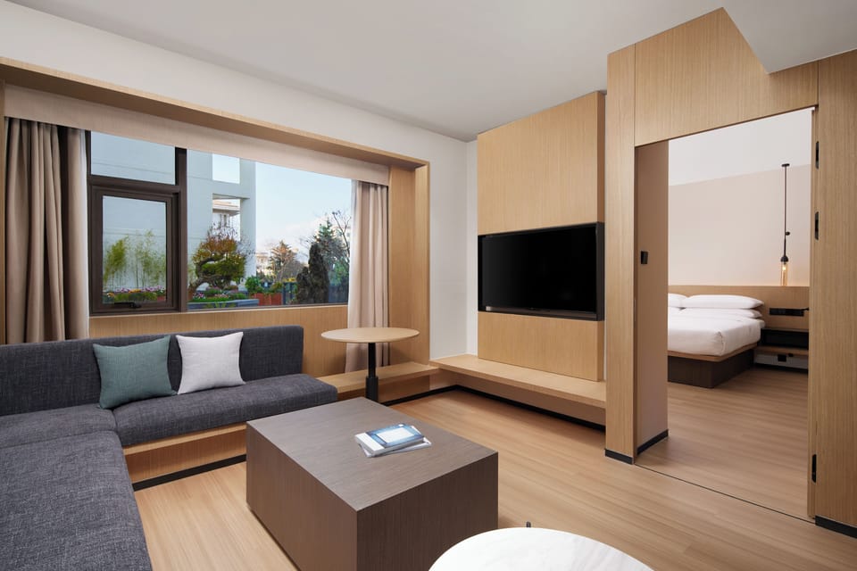 Suite, 1 King Bed, City View | Living area | LCD TV
