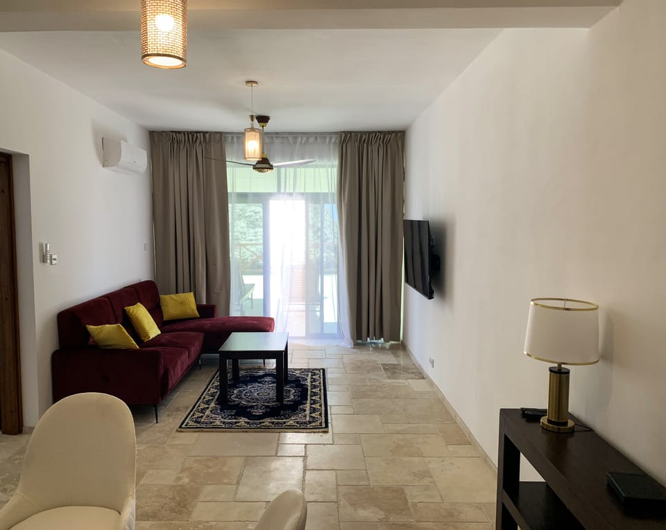 Deluxe Suite, Partial Ocean View | Egyptian cotton sheets, premium bedding, memory foam beds, minibar