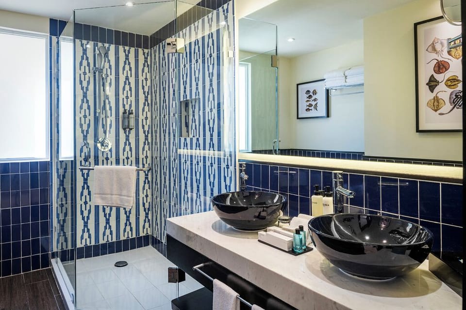 Shower, eco-friendly toiletries, hair dryer, towels