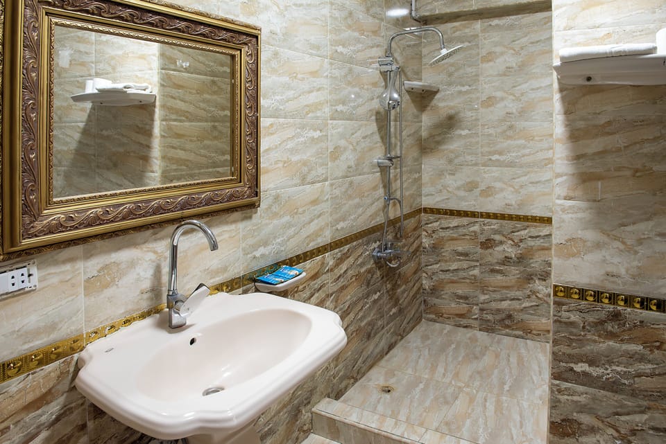 Shower, hydromassage showerhead, hair dryer, towels