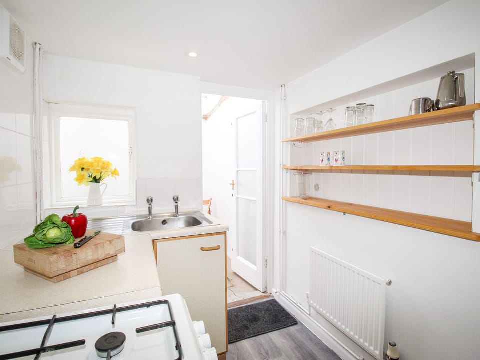 Fridge, electric kettle, toaster, cookware/dishes/utensils