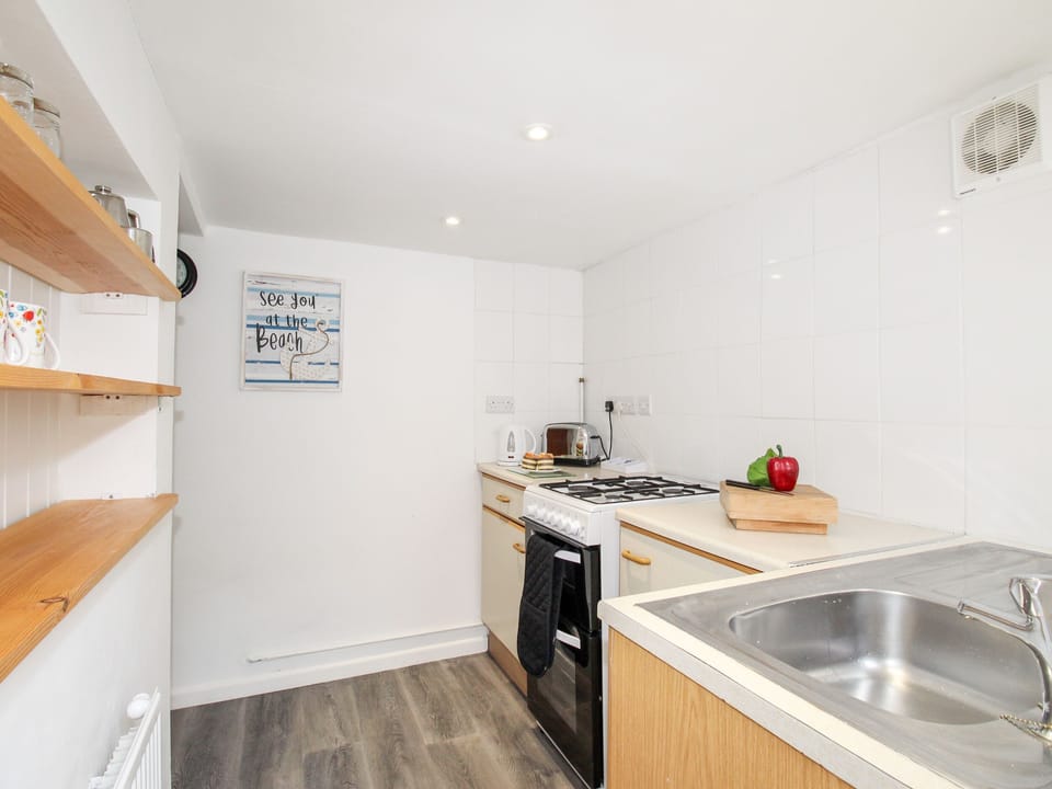 Fridge, electric kettle, toaster, cookware/dishes/utensils