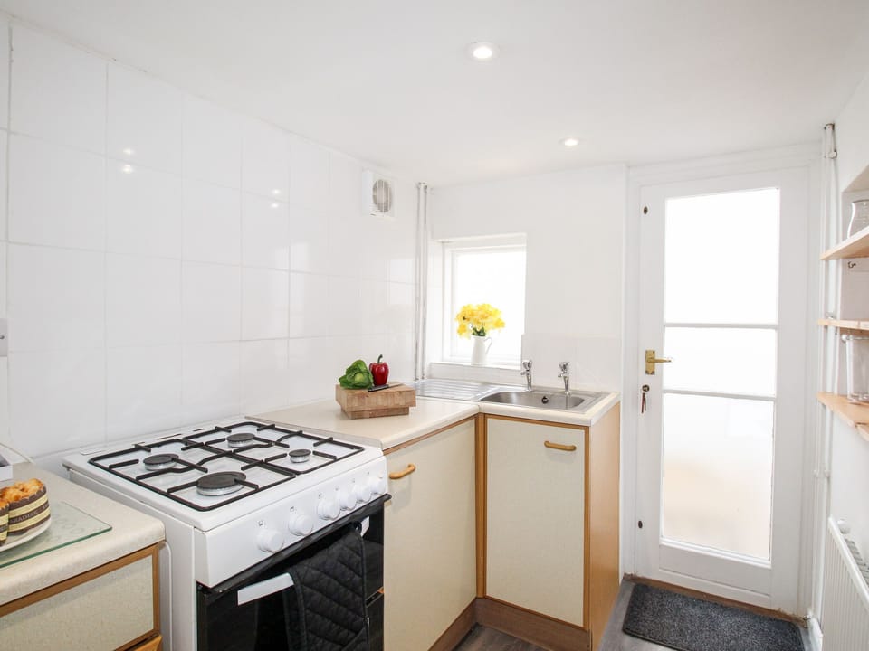 Fridge, electric kettle, toaster, cookware/dishes/utensils