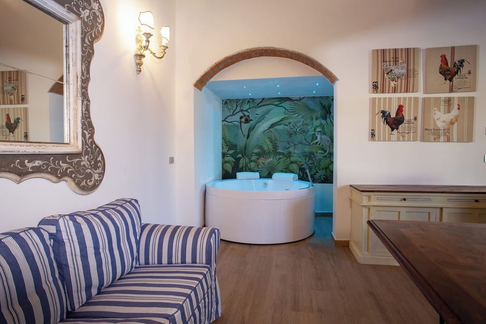 Luxury Studio Suite | Living area | 32-inch flat-screen TV with satellite channels, TV