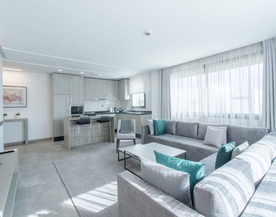 Luxury Apartment | Living area | 55-inch Smart TV with cable channels, TV, Netflix