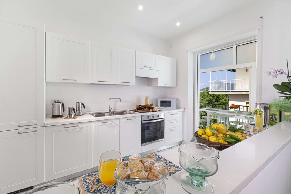 Apartment, 2 Bedrooms, Pool Access, Sea View | Private kitchen | Full-size fridge, microwave, oven, stovetop