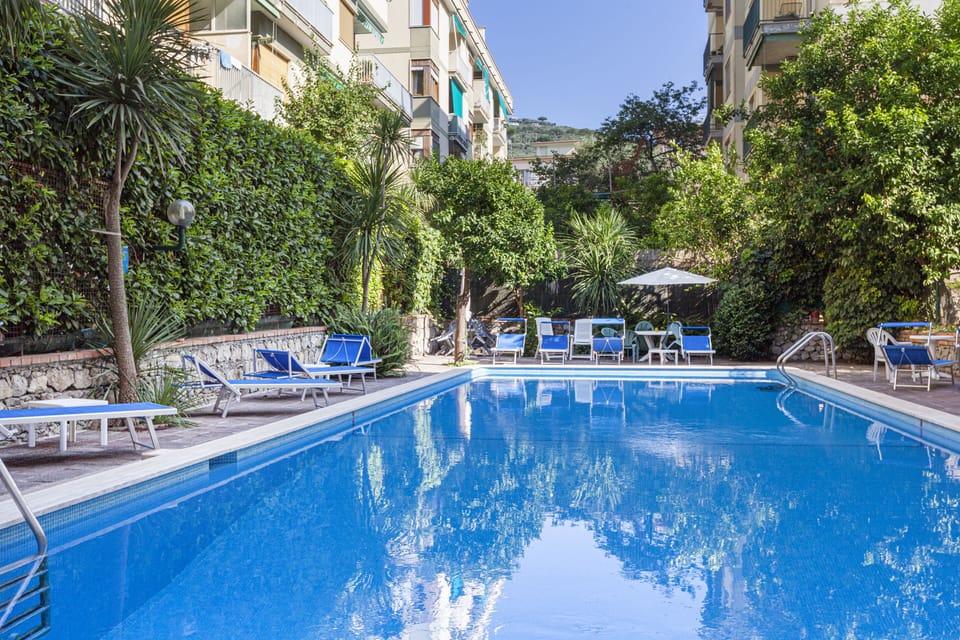 Seasonal outdoor pool, open 10:00 AM to 6:00 PM, sun loungers