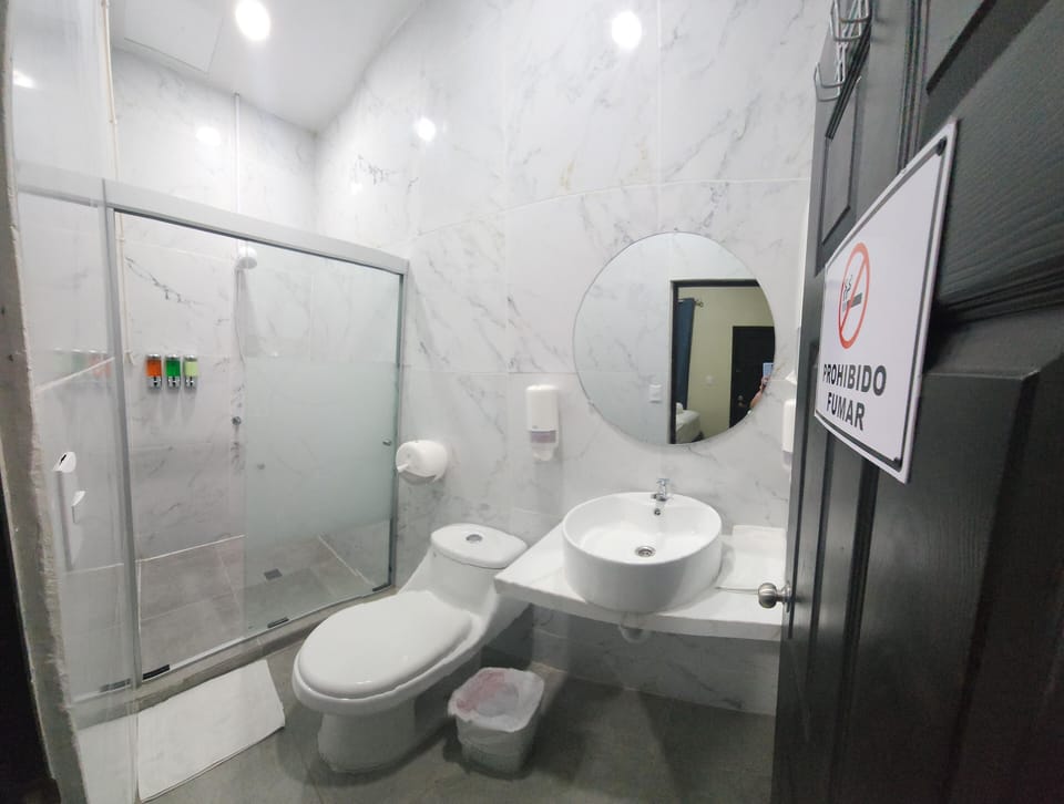 Basic Double Room | Bathroom | Shower, rainfall showerhead, towels, soap