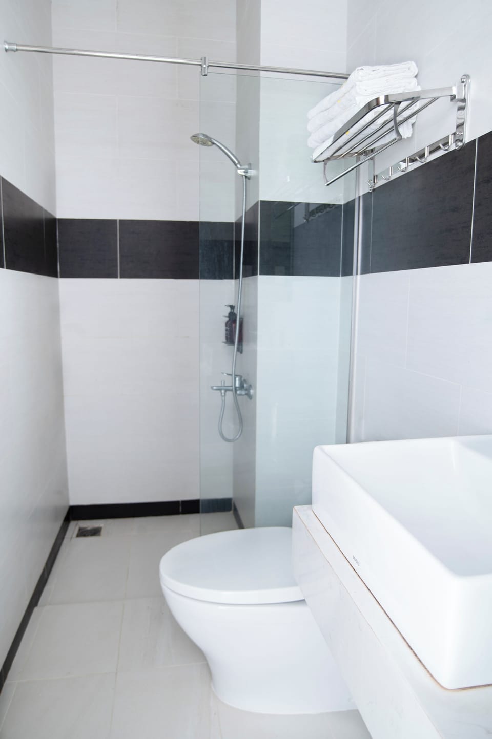 Shower, rainfall showerhead, designer toiletries, hair dryer