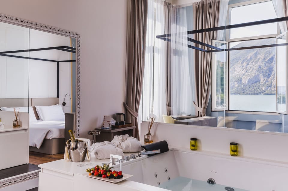 Junior Suite, Hot Tub, Lake View | Minibar, in-room safe, desk, laptop workspace
