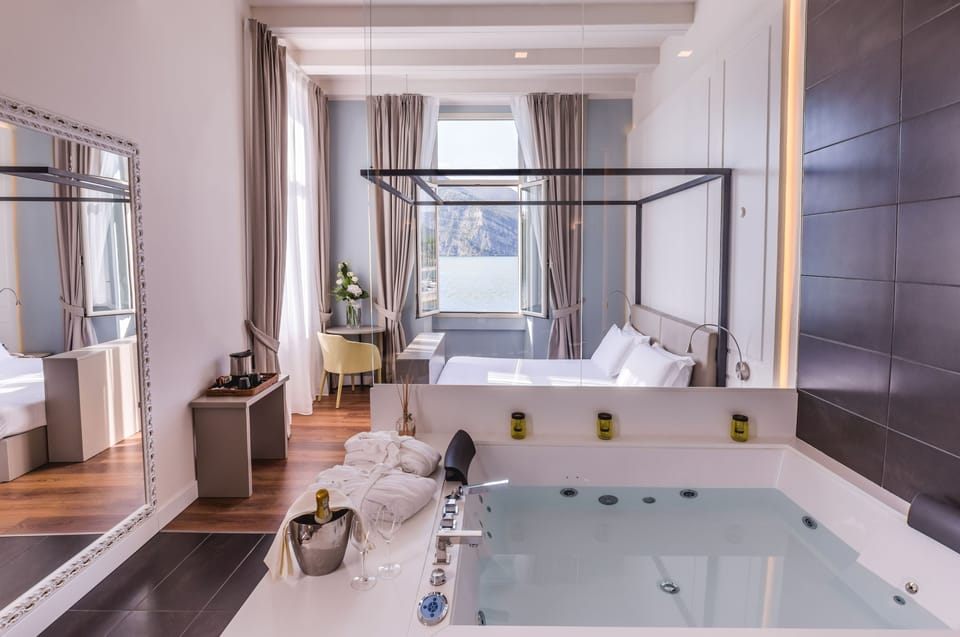 Junior Suite, Hot Tub, Lake View | Jetted tub