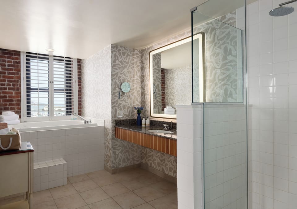 Combined shower/tub, designer toiletries, hair dryer, bathrobes