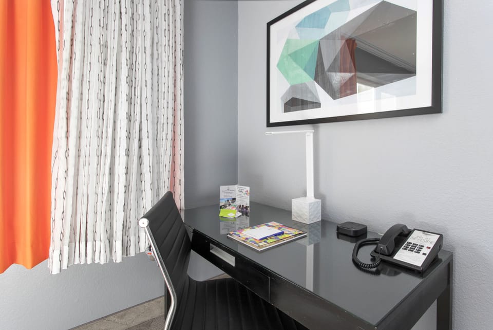 Premium bedding, desk, blackout drapes, iron/ironing board