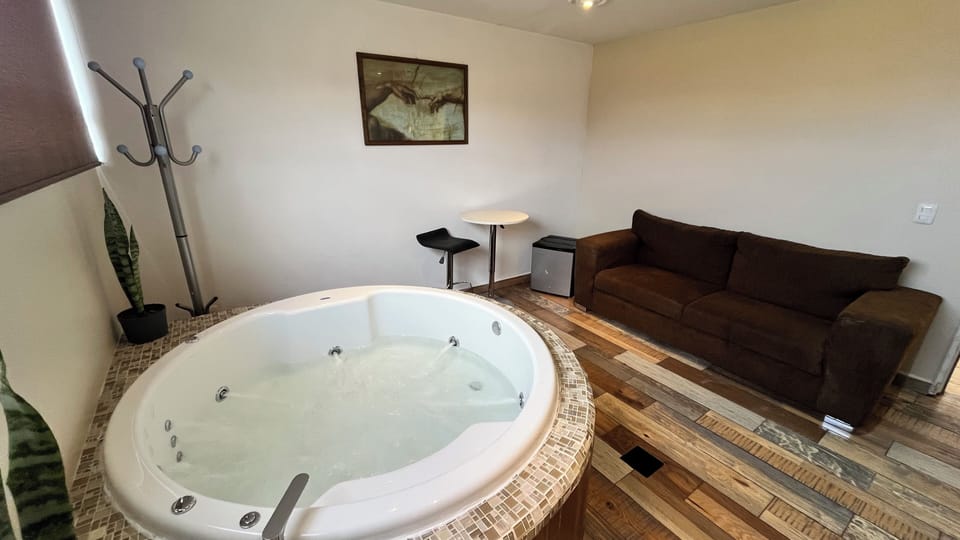 Junior Suite, Jetted Tub, Ground Floor | Private spa tub