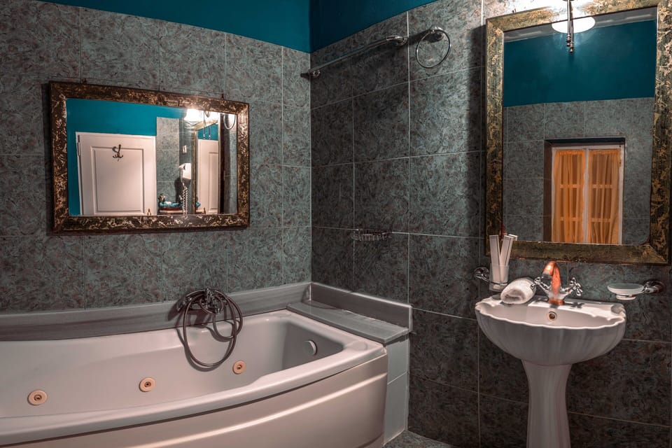 Muses Suite - 21 | Bathroom | Free toiletries, hair dryer, slippers, towels