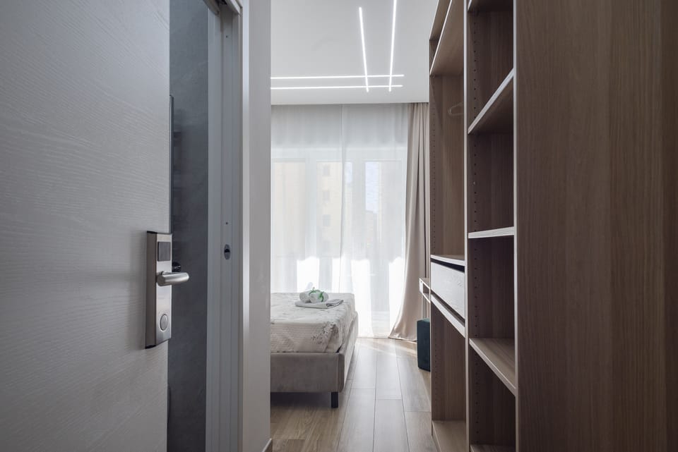 Deluxe Room, 1 Queen Bed, Balcony, City View | 1 bedroom, individually decorated, individually furnished, desk
