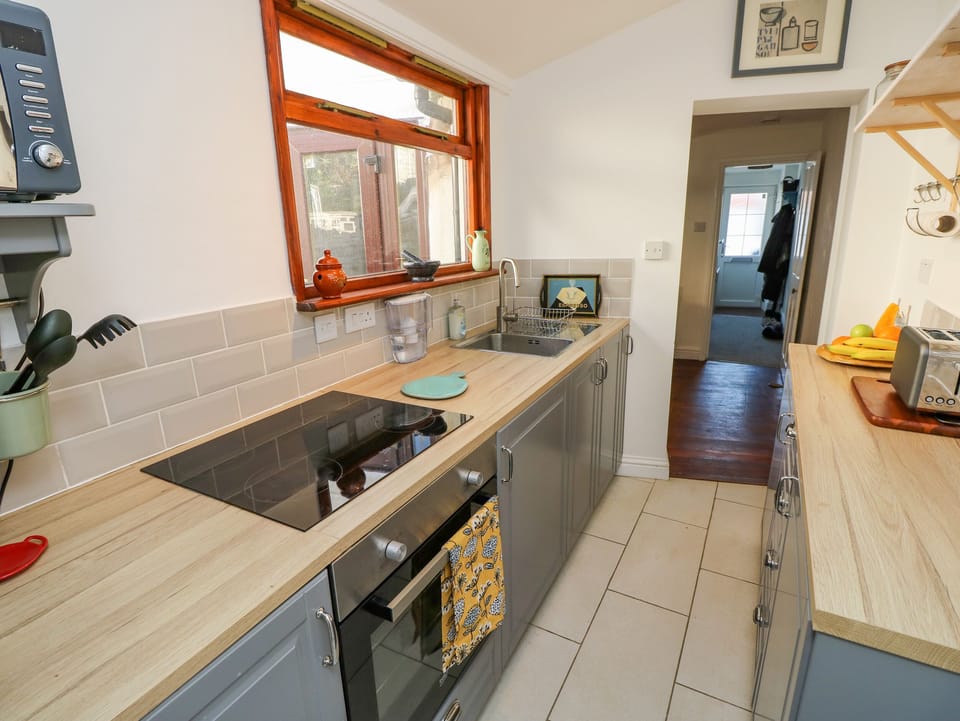 Fridge, electric kettle, toaster, cookware/dishes/utensils