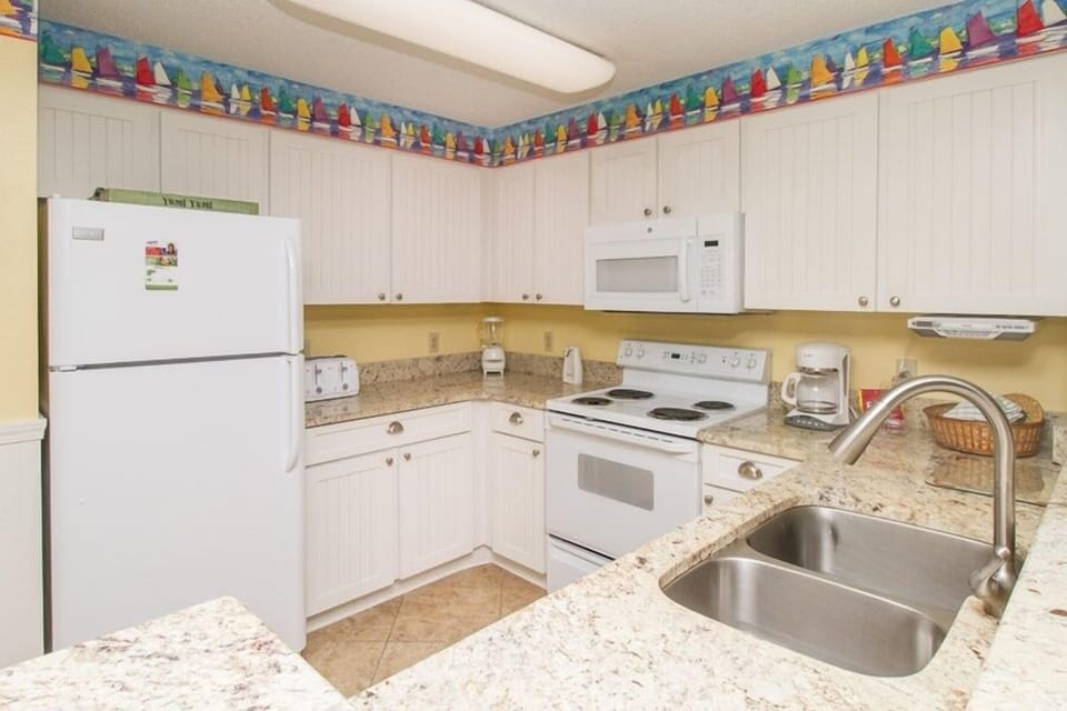 Condo, 2 Bedrooms | Private kitchen | Coffee/tea maker, fridge, oven, toaster
