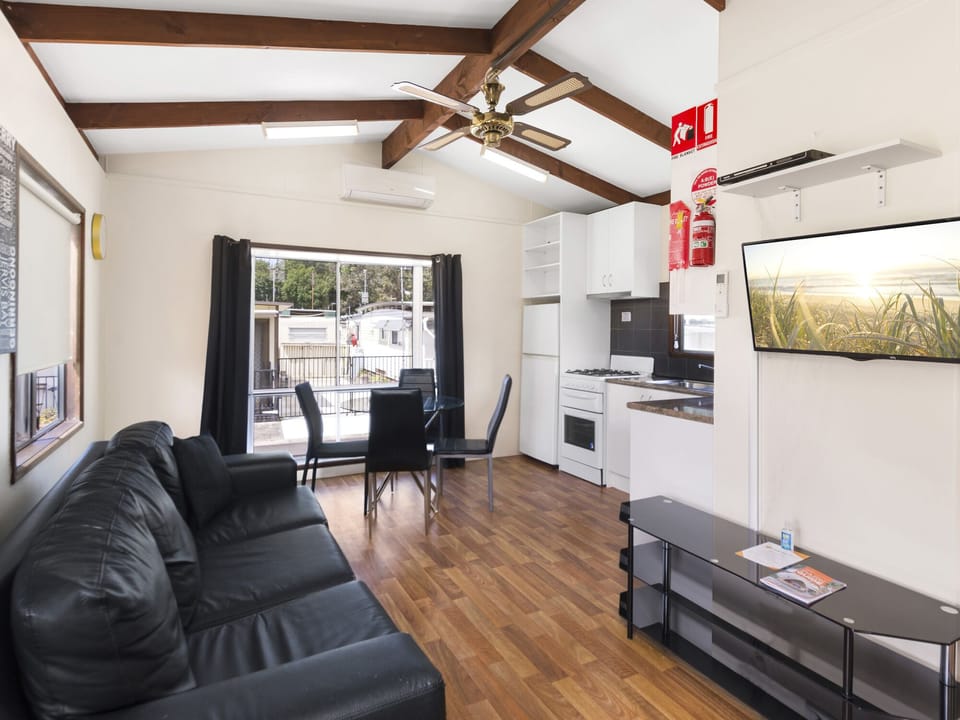 Economy 2 Bedroom Cabin | Living area | TV, table tennis