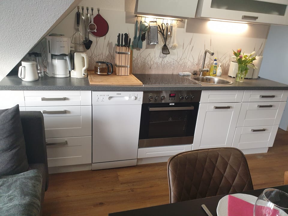 Deluxe Apartment, 4 Bedrooms | Private kitchen | Shared fridge, microwave, espresso maker, coffee/tea maker