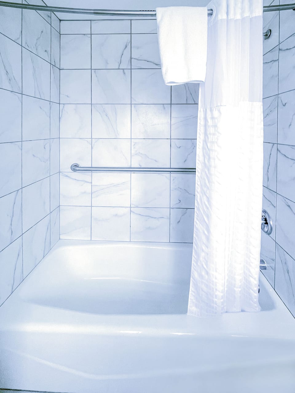 Standard Two Queen | Bathroom | Hair dryer, slippers, towels, soap