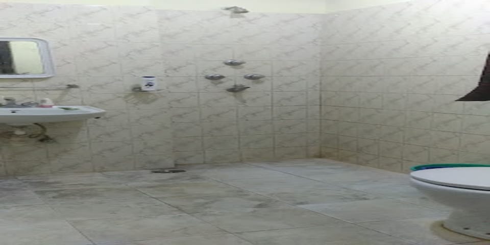 Shower, rainfall showerhead, towels, soap