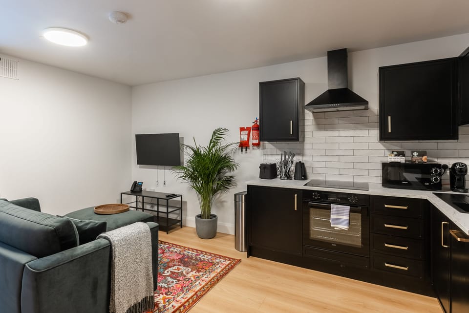 Superior Two Bedroom Lower Ground Floor Apartment (150m from Isaacs Hotel) Access By Stairs Only | Living area | TV