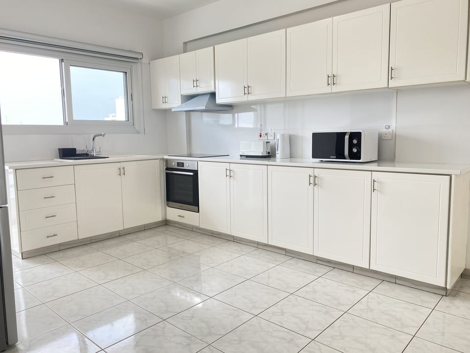 Luxury Apartment | Private kitchen | Coffee/tea maker, full-size fridge, microwave, oven