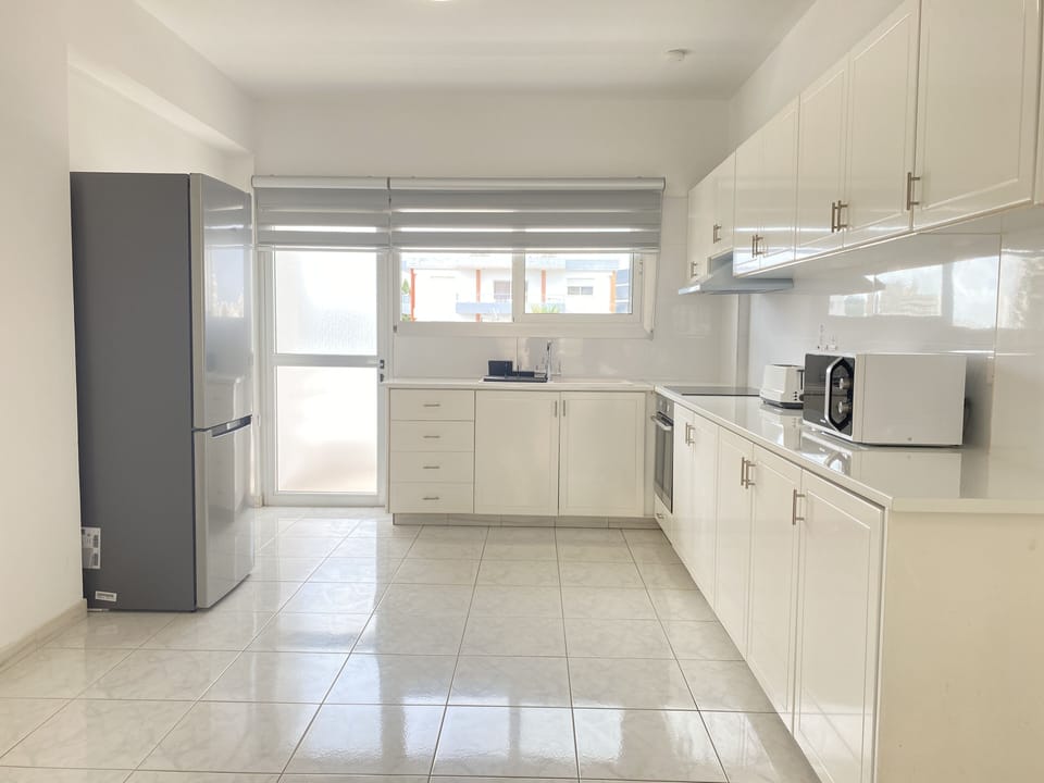 Luxury Apartment | Private kitchen | Coffee/tea maker, full-size fridge, microwave, oven