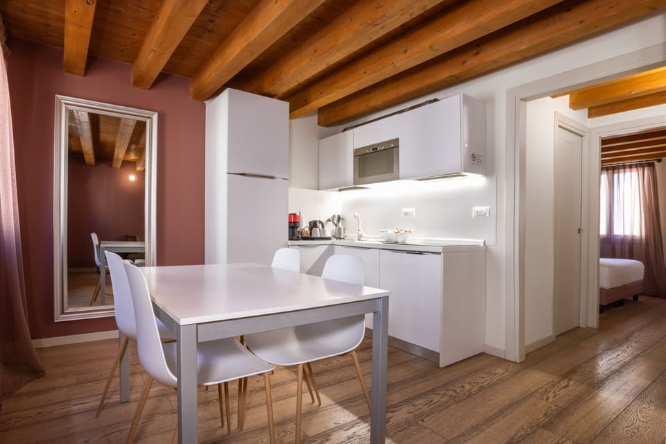 Superior Apartment, Kitchenette, City View | Living area | 32-inch flat-screen TV with satellite channels, TV