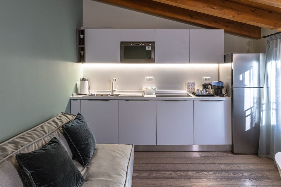 Deluxe Penthouse, Kitchenette, Canal View | Living area | 32-inch flat-screen TV with satellite channels, TV