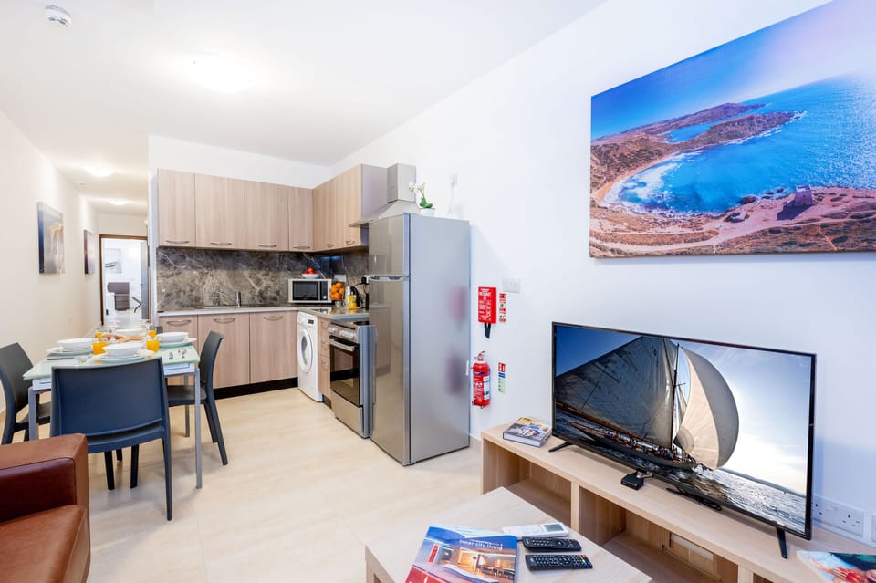 Standard Apartment | Living area | 43-inch LCD TV with satellite channels, TV